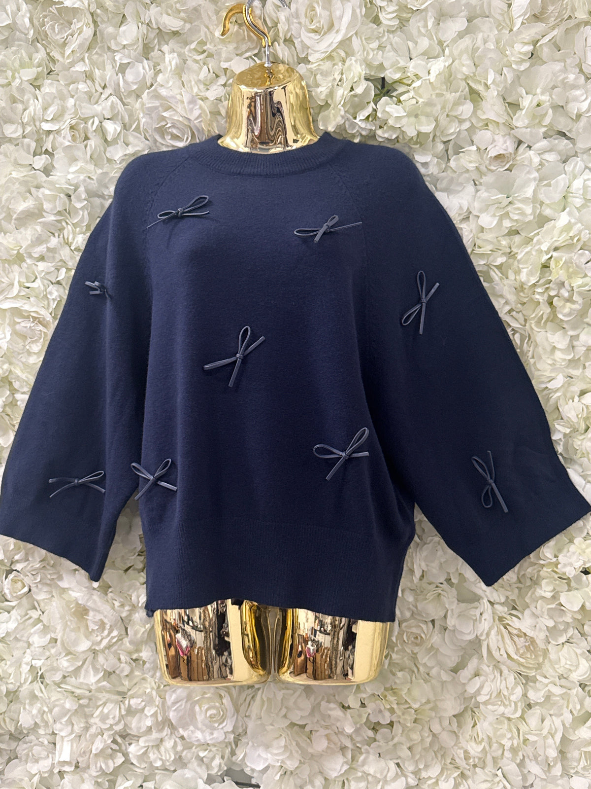 Stunning navy jumper with faux leather bows, Flick